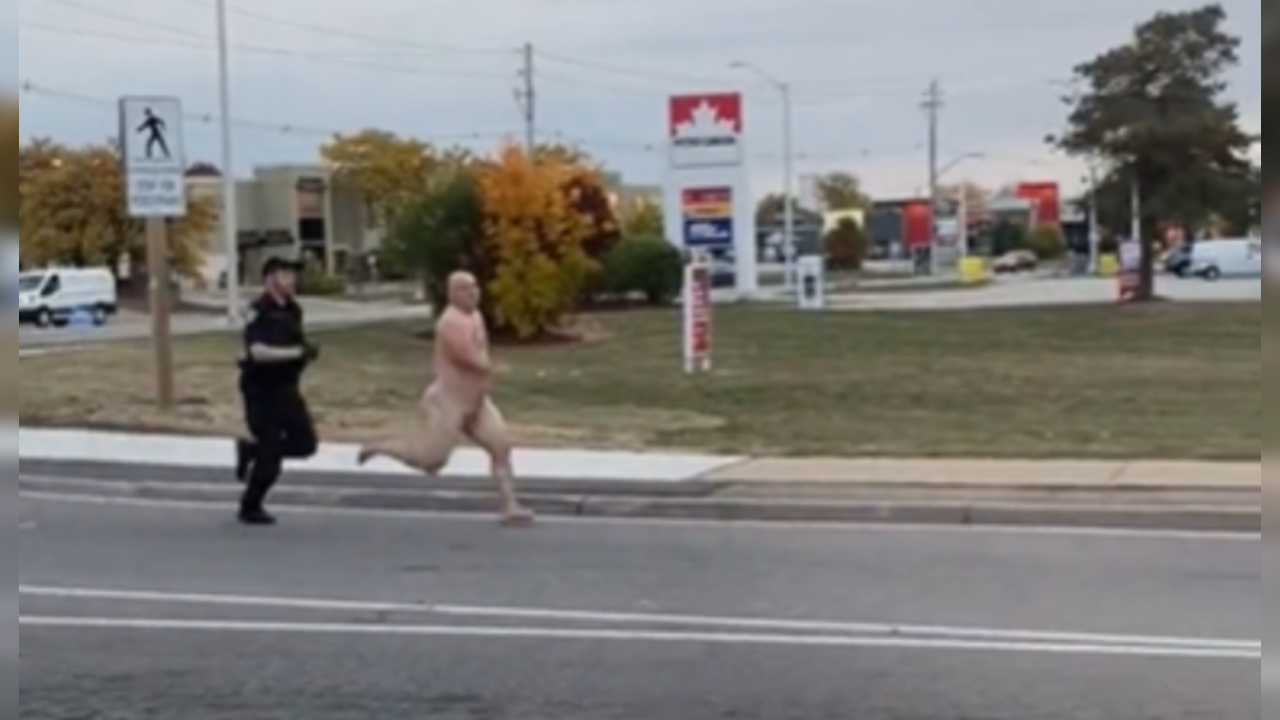 Naked man evading an HRPS officer | Twitter